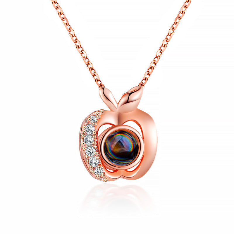 Diamond studded heart-shaped projection necklace