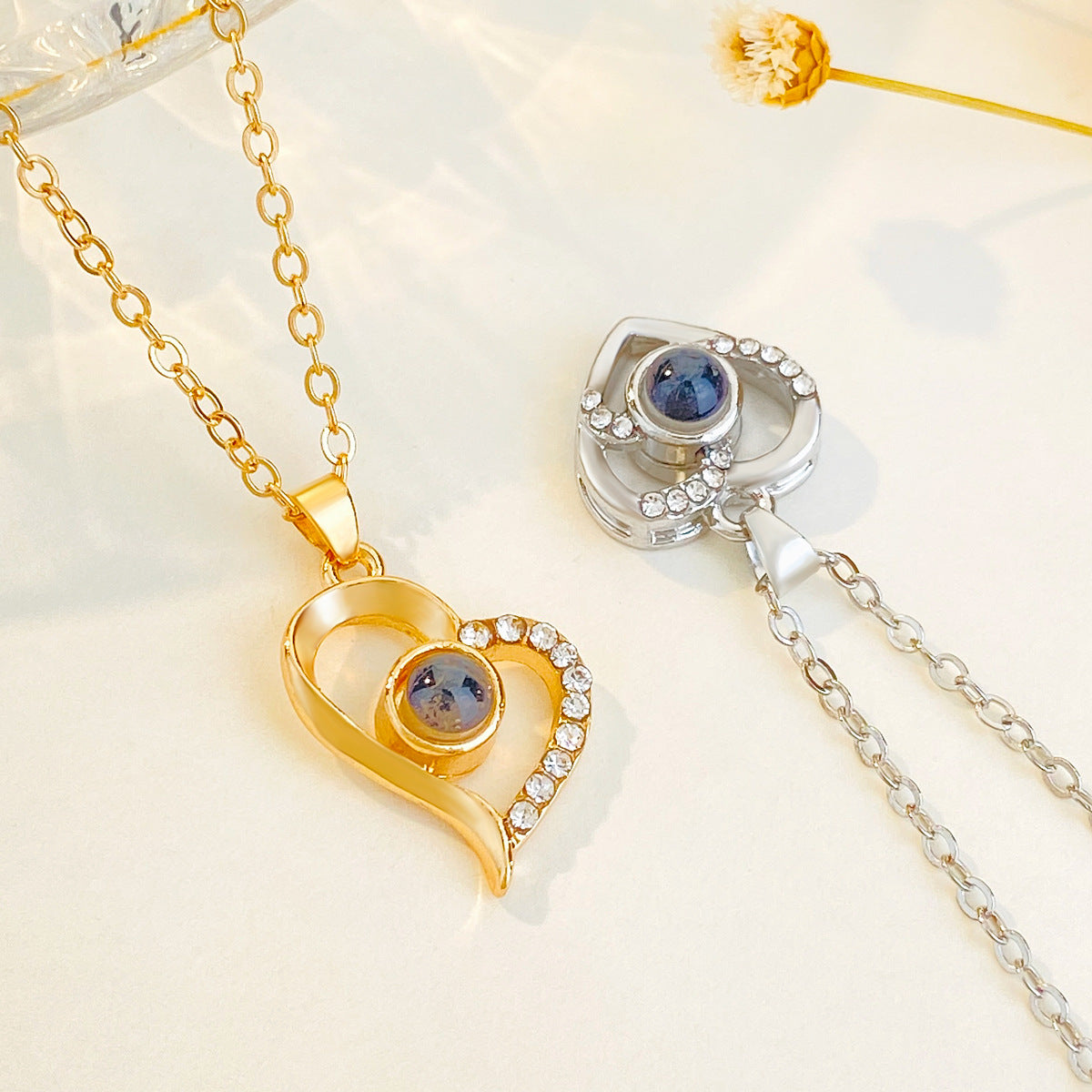 Diamond studded heart-shaped projection necklace